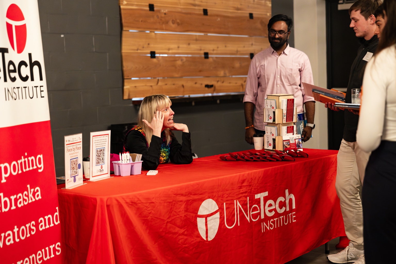 Stephanie at a UNeTech event table